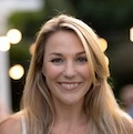 Portrait of young woman smiling after a free consultation with a local lawyer.